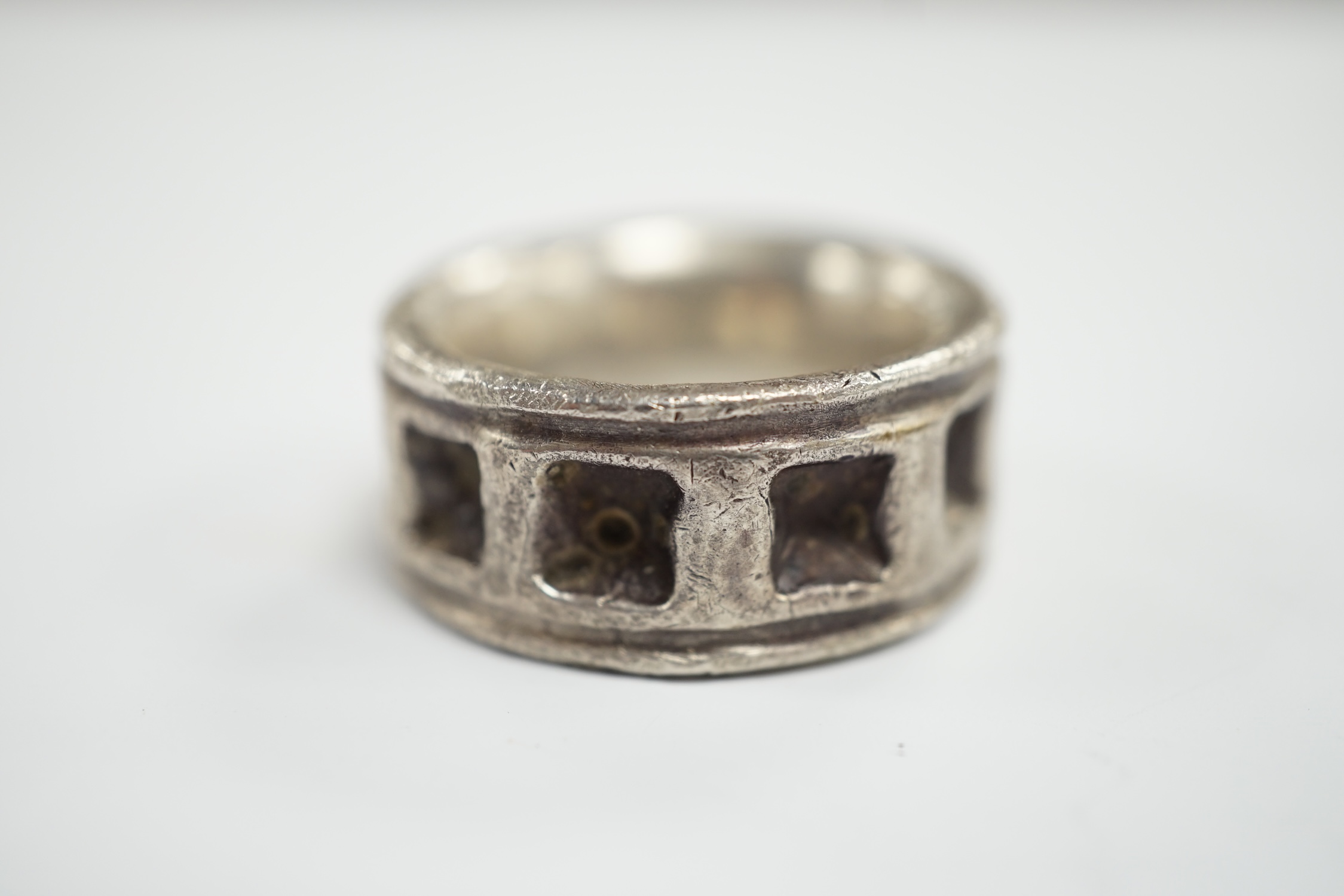 A carved heavy gauge white metal ring, thought to be of Viking origin?, size Q/R, 31.8 grams.